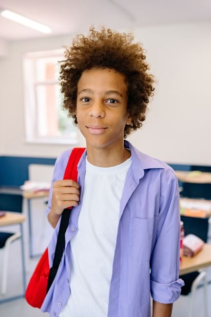 A happy teenage student smiling